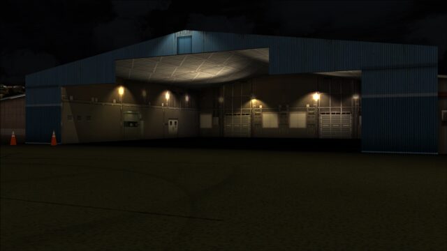 GA hangar lit up at night