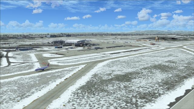 Snow drifted on edges of taxiway