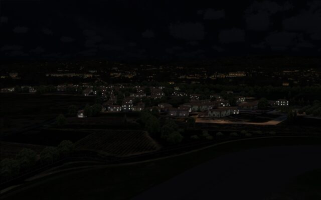 Nearby residential buildings lit up